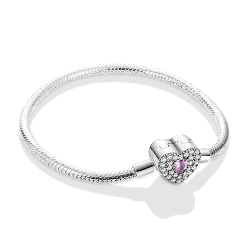 Pulseira em prata com fecho coração cravejado de zircónias e cristal rosa.