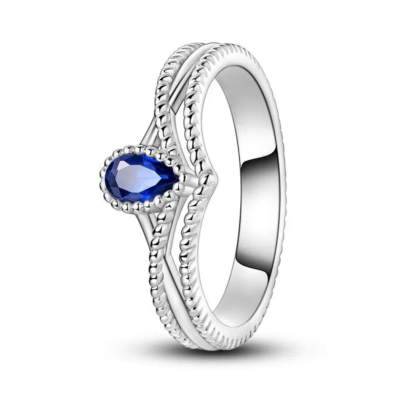 Anel wishbone em prata com zircónia azul em formato de gota.