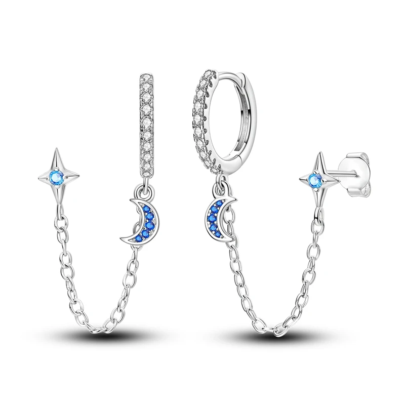 Brincos de prata com uma lua crescente e uma estrela de quatro pontas, ambos com zircónias azuis.