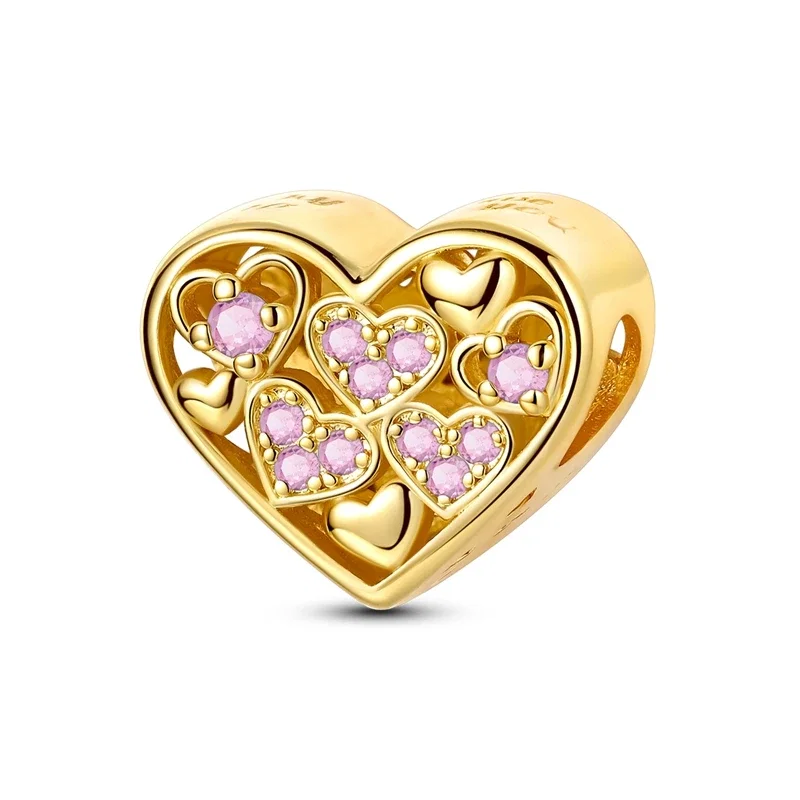 Berloque dourado em forma de coração vazado com zircónias cor-de-rosa montado em prata 925