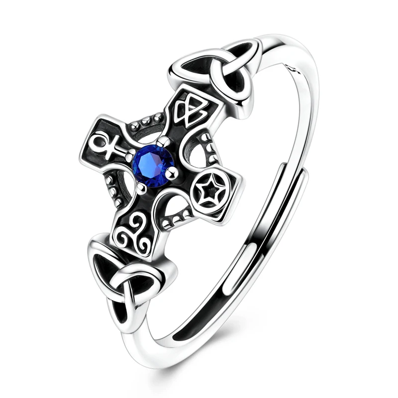 Anel ajustável em prata com cruz celta, zircónia azul e nós triquetra.