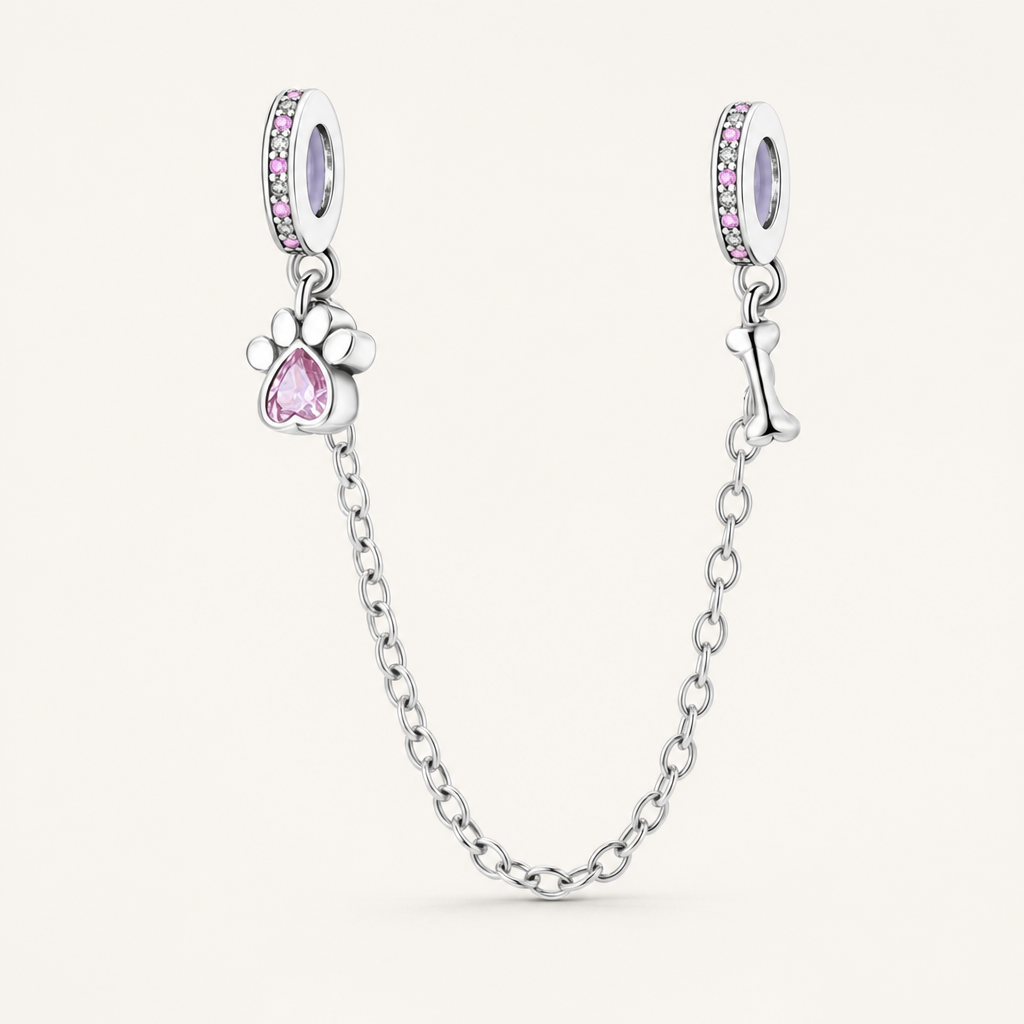 Corrente de segurança em prata com pingente de pata de gato com zircónia rosa e pingente de osso de cão.
