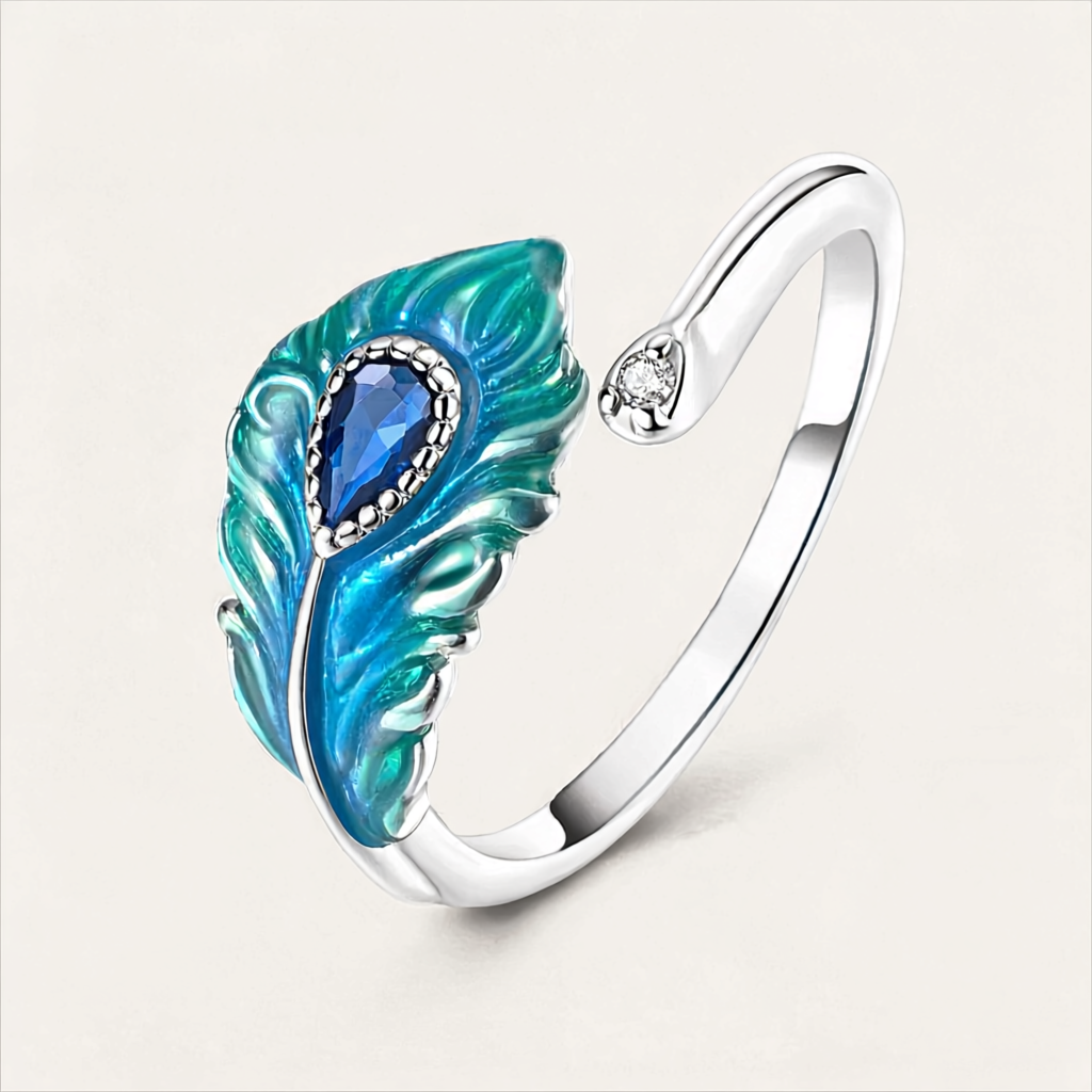 Anel ajustável em prata com motivo de pena de pavão em esmalte azul e zircónia.