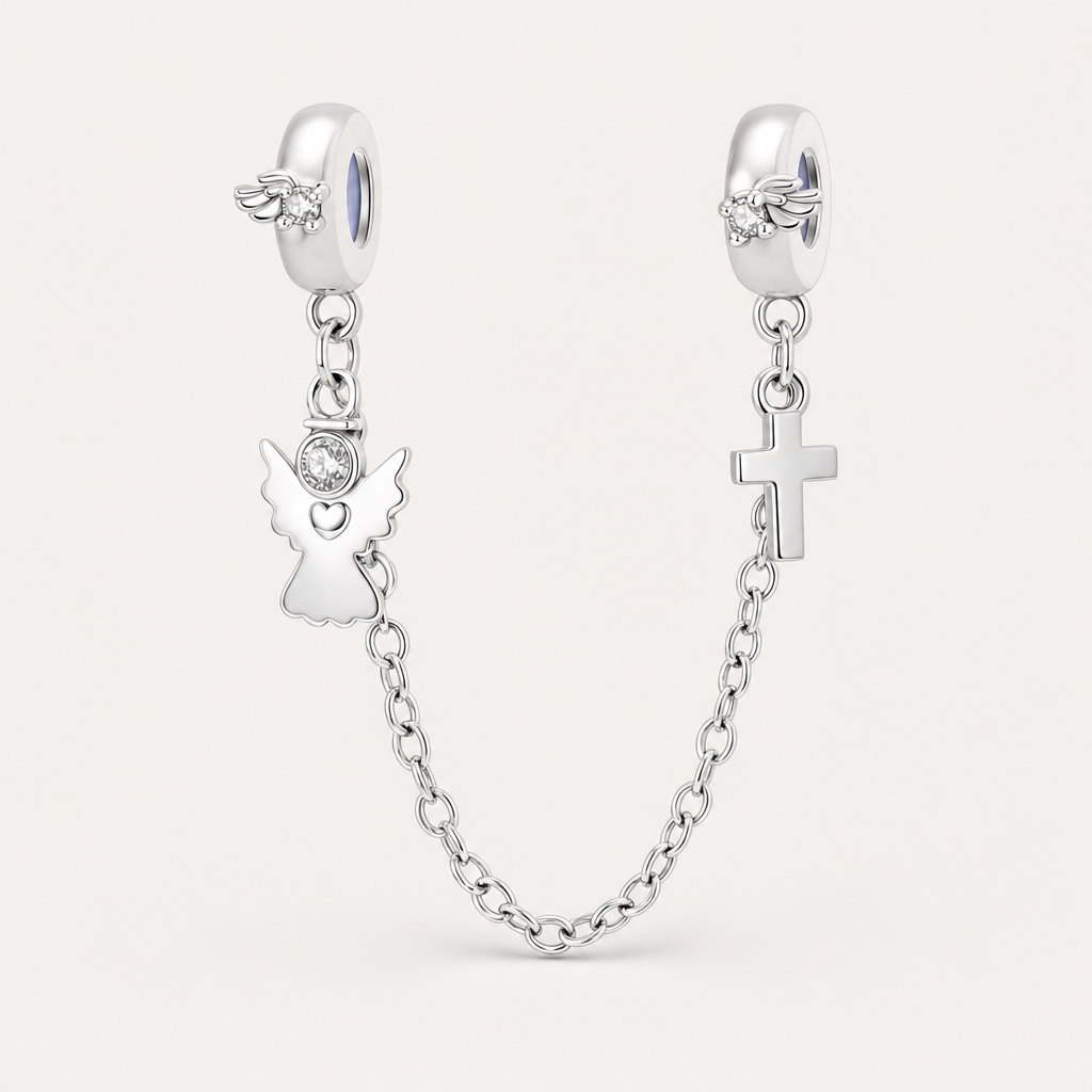 Pulseira de segurança em prata com anjo cravejado de zircónia e cruz pendente.
