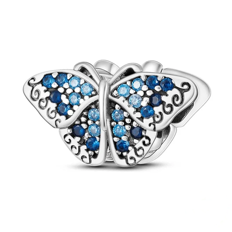 Berloque de borboleta azul com asas cravejadas em zircónia e corpo em prata polida