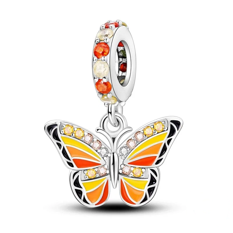 Charm pendente de borboleta monarca em prata com esmalte laranja e amarelo e zircónias