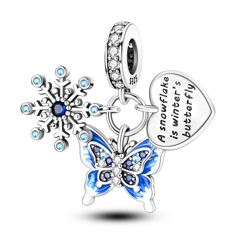 Pendente em prata com floco de neve com zircónias, borboleta em esmalte azul e coração gravado com frase