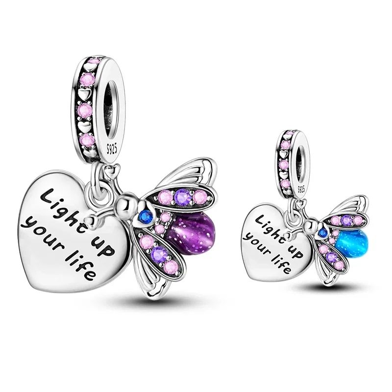 Charm de prata com vagalume luminoso e asas de zircónia, e um pingente de coração gravado 'Light up your life'