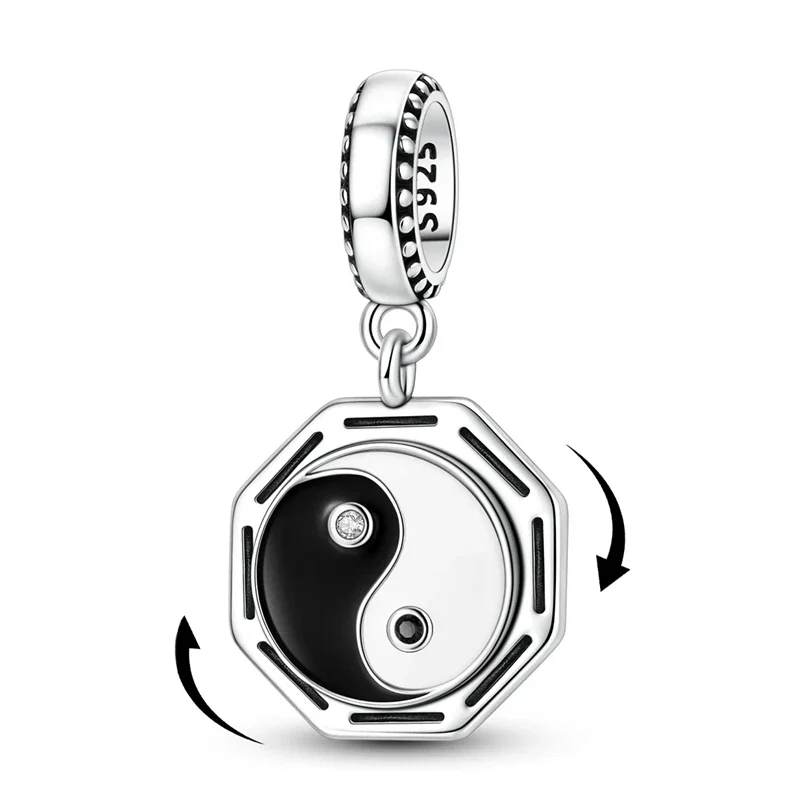 Pingente dangle em prata 925 com medalhão octogonal giratório exibindo o símbolo Yin Yang em esmalte preto e branco