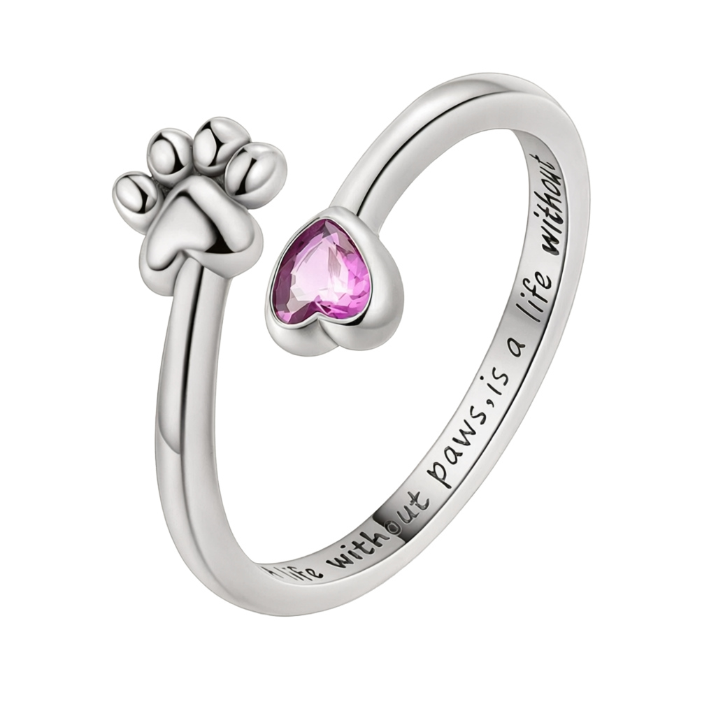 Anel ajustável em prata com pata de gato e cristal de zircónia cor-de-rosa em forma de coração.